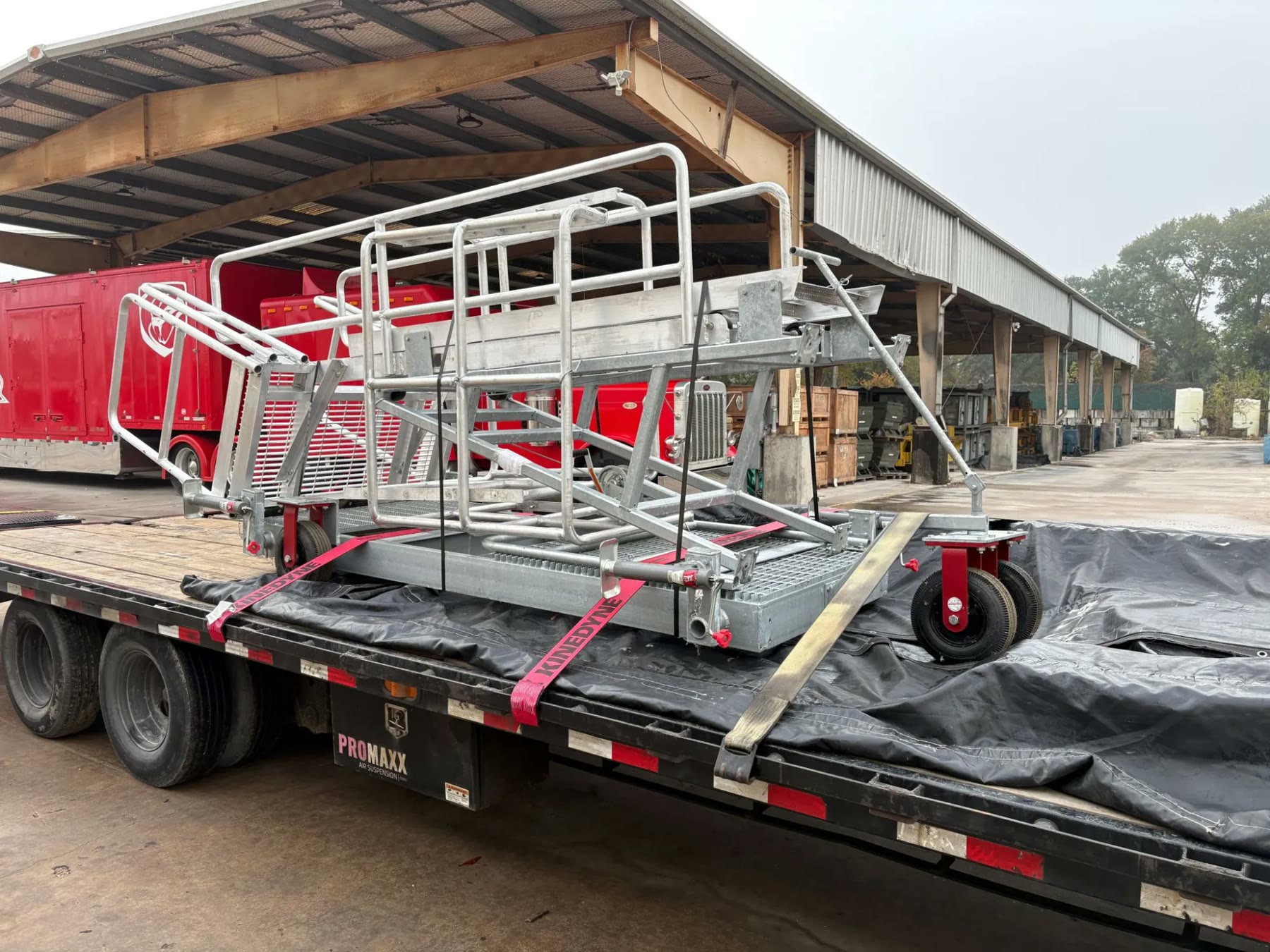 Mobile gangway unit strapped to a flatbed for delivery